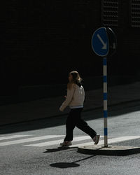 Full length of woman on road