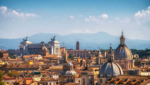 Panoramic view of buildings in city against sky