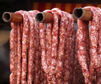 Sausages on bamboos for sale at street market