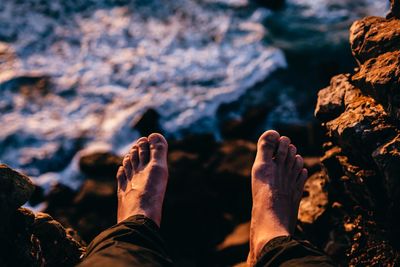 Low section of man on rock formation