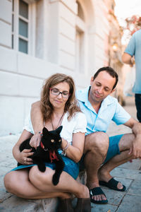 Portrait of friends sitting outdoors