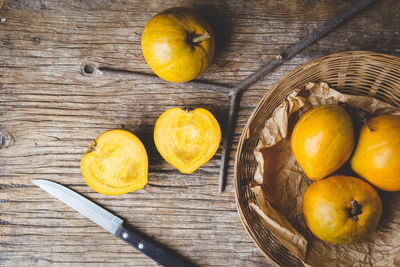 High angle view of fruits in basket on table