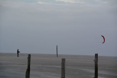 Parachuting on calm beach