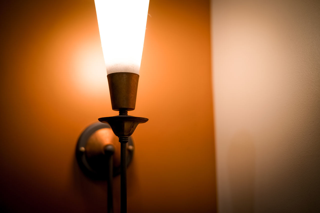 light, lighting equipment, lamp, illuminated, electricity, light fixture, indoors, yellow, electric lamp, no people, lighting, glowing, incandescent light bulb, darkness, close-up, light - natural phenomenon, light bulb, technology, street light, burning, power generation, copy space, single object, orange color, fire, electric light