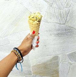 Close-up of hand holding ice cream cone