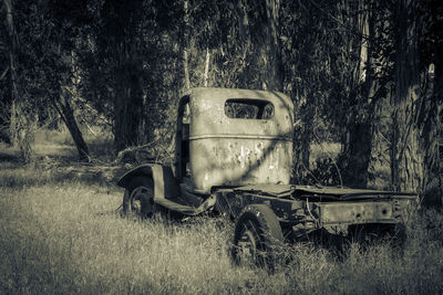 Abandoned truck on field