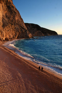 Scenic view of beach against clear sky