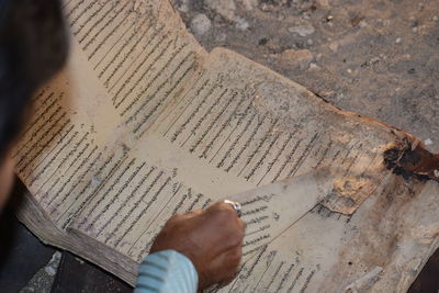 High angle view of man reading book