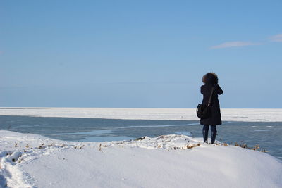 Full length of man standing on beach