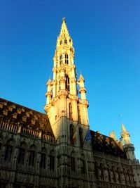 Low angle view of church against blue sky