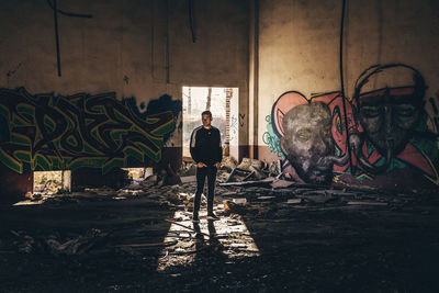 Man standing in abandoned building