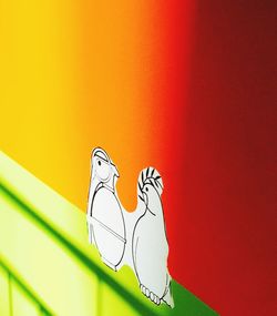 Close-up of red carving on wall