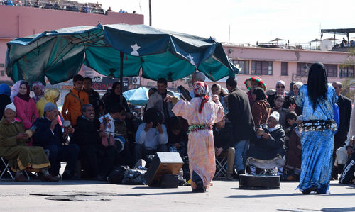 People on street market in city