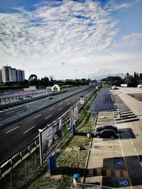 High angle view of highway in city against sky