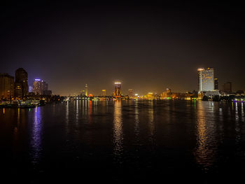 View of buildings lit up at night