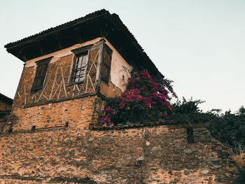 Low angle view of old building against clear sky