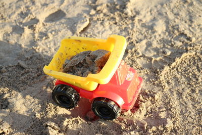 High angle view of toy car on sand