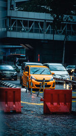 View of red car on street in city