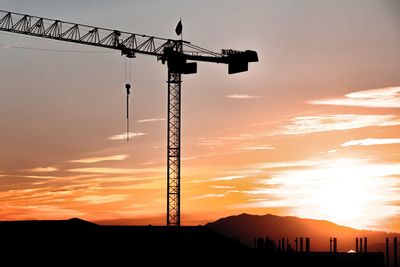 Low angle view of silhouette mountain against sky during sunset