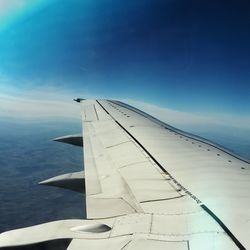 Cropped image of sea against blue sky