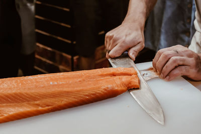 Midsection of man preparing food