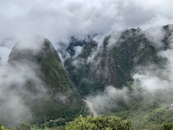 Scenic view of mountainsn against sky and clouds