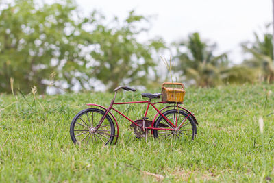 Bicycle leaning on field