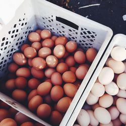 High angle view of eggs in crates for sale at market