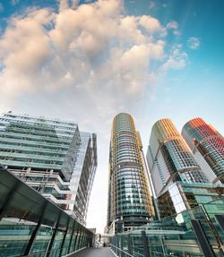 Low angle view of modern buildings in city against sky