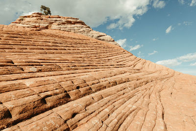 Diagonal lines of red rock in petrified sand dunes of southern utah