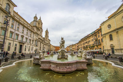 Fountain at piazza navona against cloudy sky