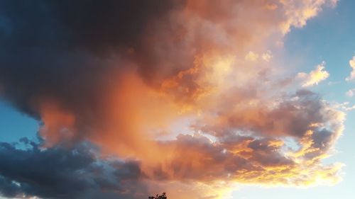 Low angle view of dramatic sky during sunset