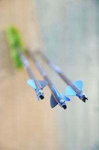 High angle view of raindrops on blue metal