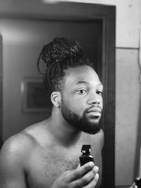 Portrait of young man looking away