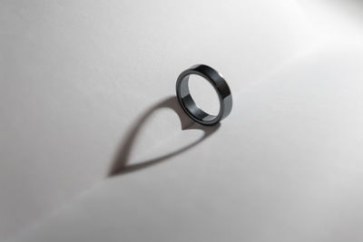 Close-up of wedding rings on white background