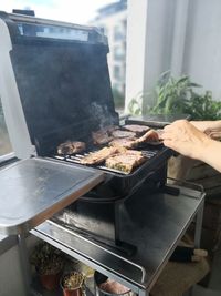 Man preparing food on barbecue grill