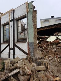 Damaged building against sky