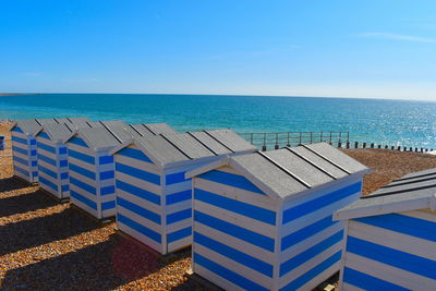 The british sussex coastline is a popular location for having a stripped wooden beach hut on