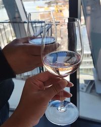 Close-up of hand holding wine glass