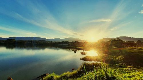 Scenic view of lake against sky during sunset