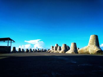 Low angle view of sculpture against blue sky