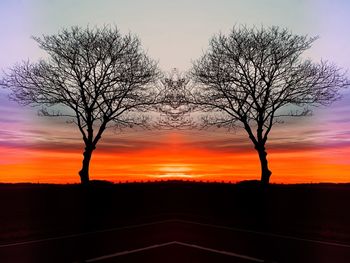 Silhouette bare tree against romantic sky at sunset