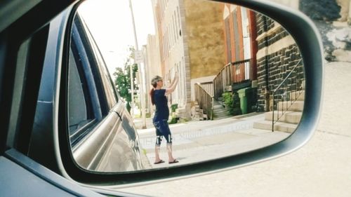 Reflection of woman in mirror