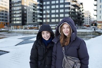 Portrait of smiling women in modern neighborhood