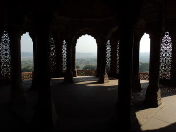 View from one of the dark tower of agra fort, under the arches and the carved windows.