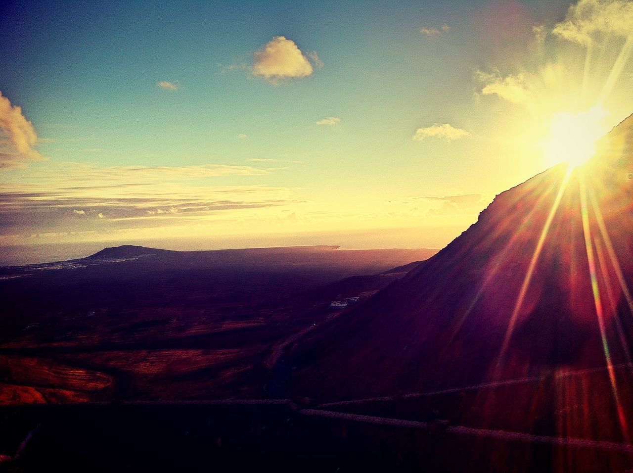 sun, sunset, sunbeam, mountain, lens flare, scenics, sky, sunlight, beauty in nature, tranquil scene, tranquility, landscape, nature, mountain range, idyllic, cloud - sky, non-urban scene, orange color, travel, transportation