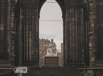 Low angle view of scots monument, princes street, edinburgh, scotland, uk