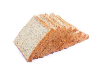 Close-up of bread against white background