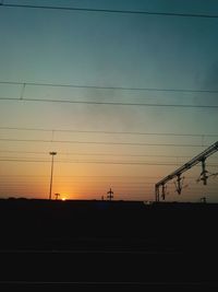 Silhouette landscape against sky during sunset