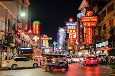 View of traffic on city street at night